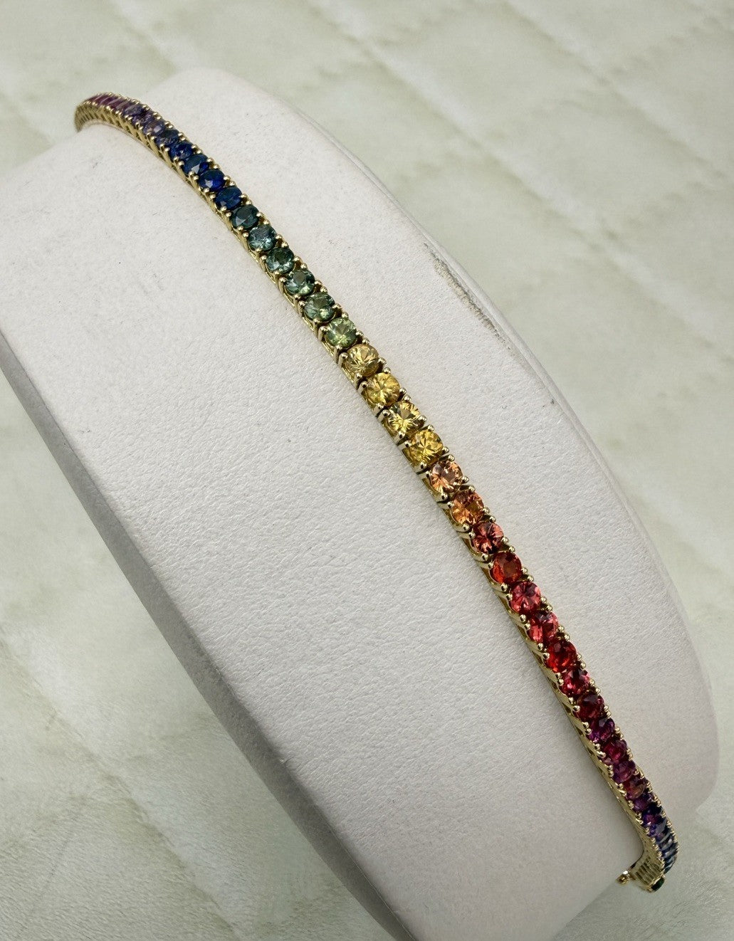 Bracciale tennis rainbow in oro giallo 18 kt con zaffiri multicolor