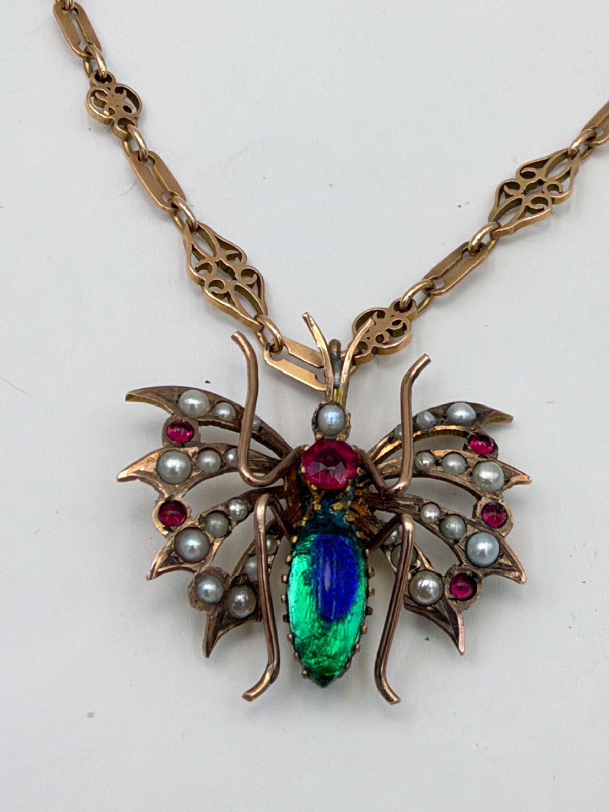 Collana antica in oro 6/7 kt con pendente a farfalla, perle e pietre rosse – foto 8