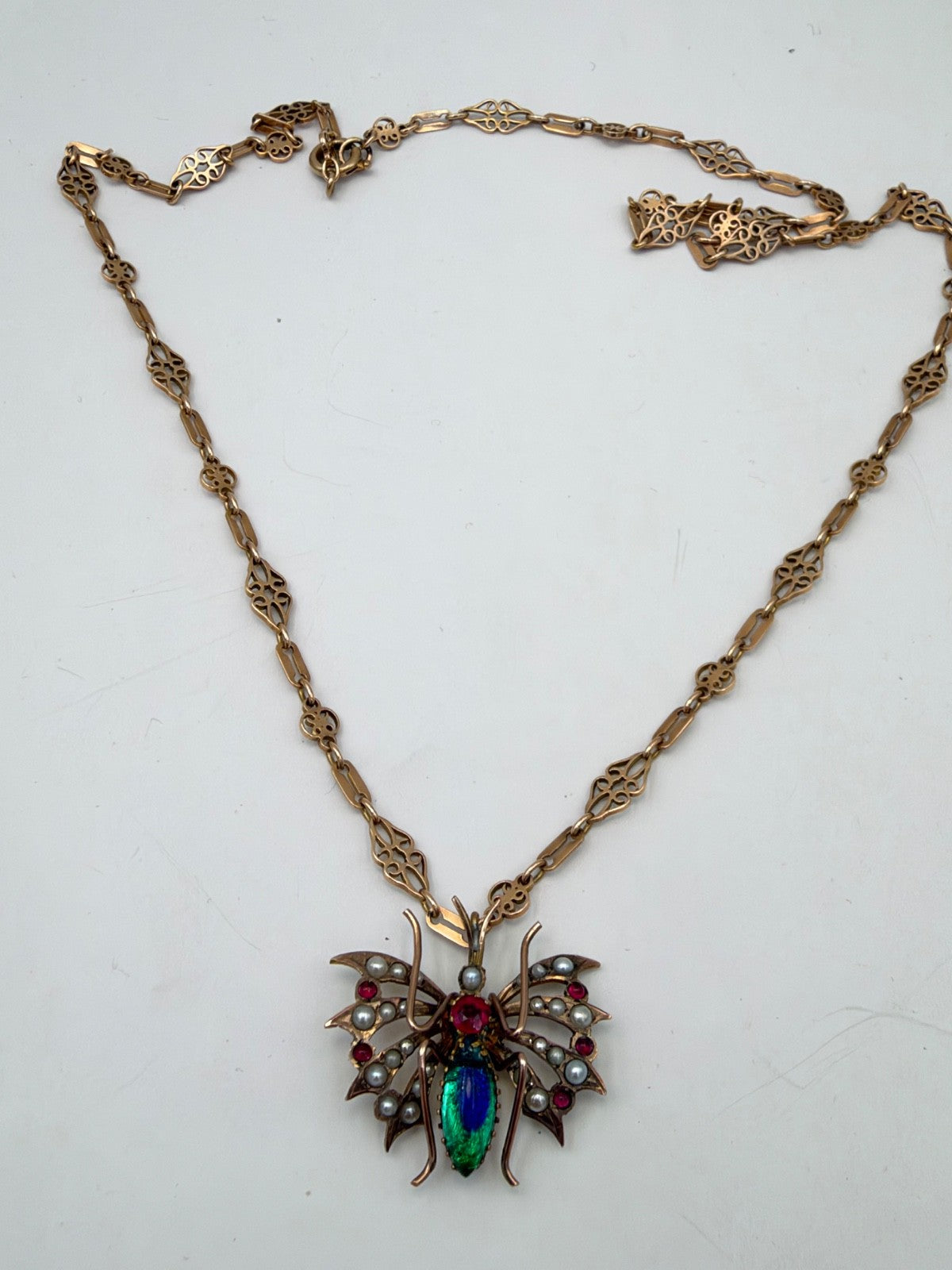 Collana antica in oro 6/7 kt con pendente a farfalla, perle e pietre rosse – foto 9